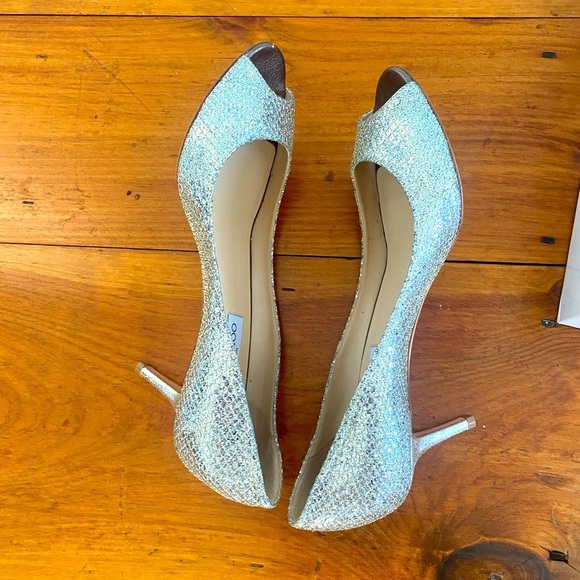 Jimmy Choo Shoes - SILVER Jimmy Choo heels never worn